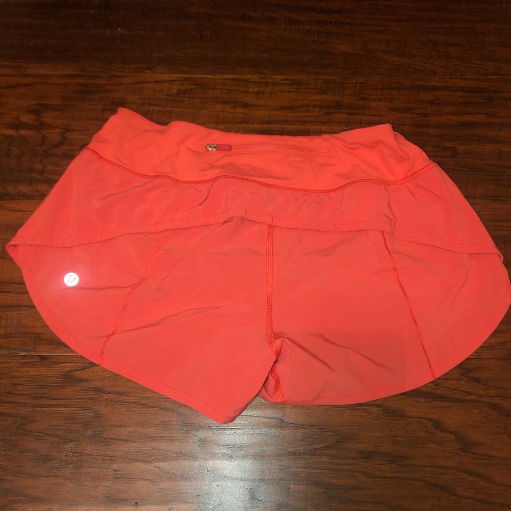 Orange Lululemon size 6 regular shorts
